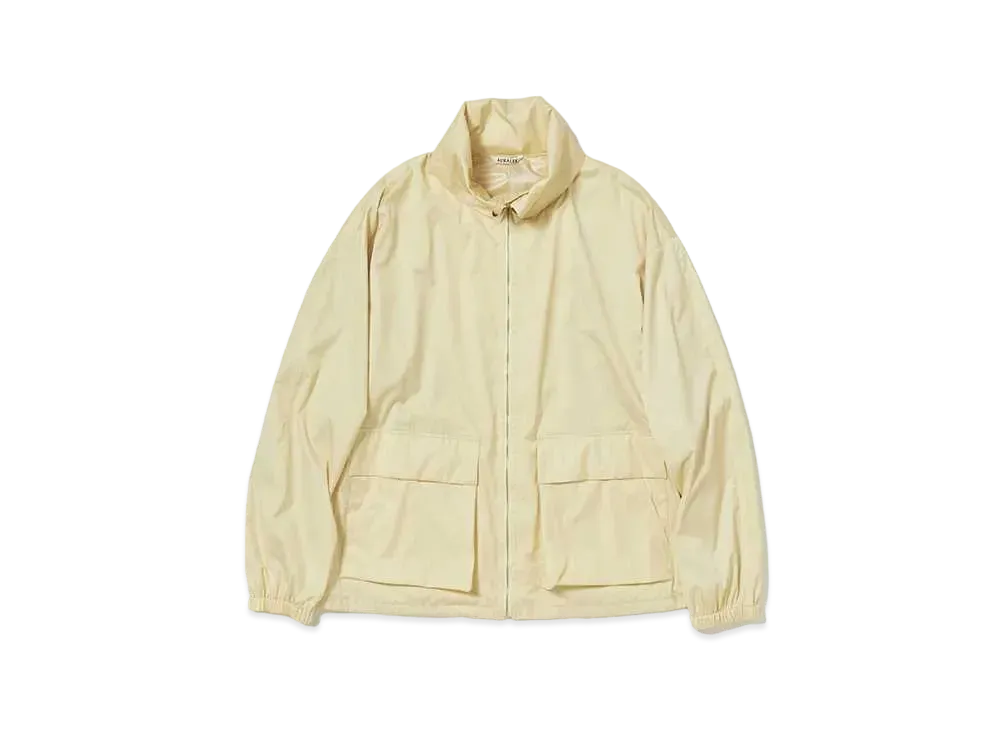 AURALEE Hard Twist Polyester Satin Laminate Zip Blouson "Light Beige"