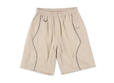 WIND AND SEA Reflective Piping Baggy Track Short "Sand"