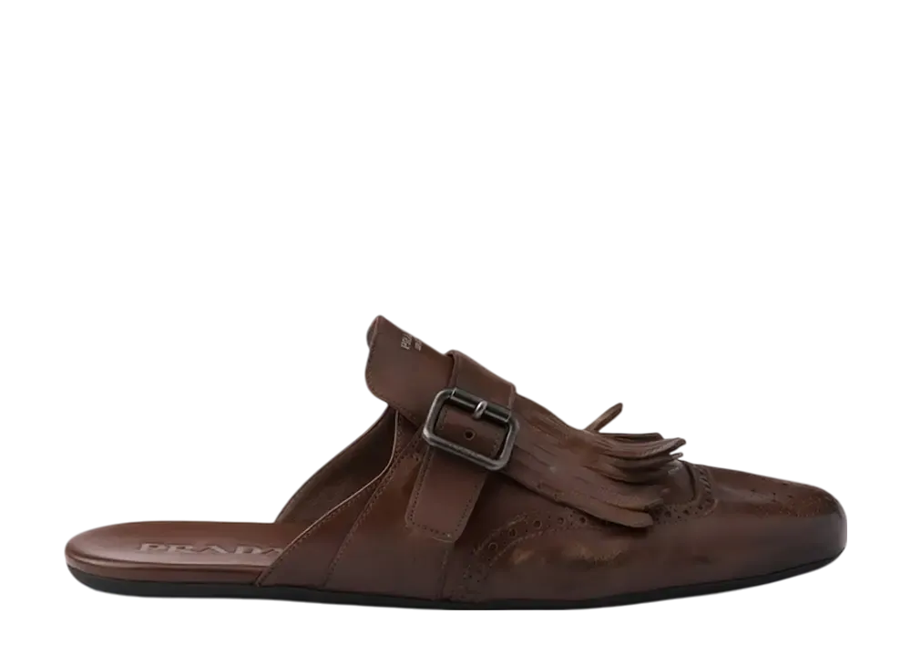 プラダ シャッフル バックルストラップ & フリンジ付 アンティークレザー ミュール "コニャック"