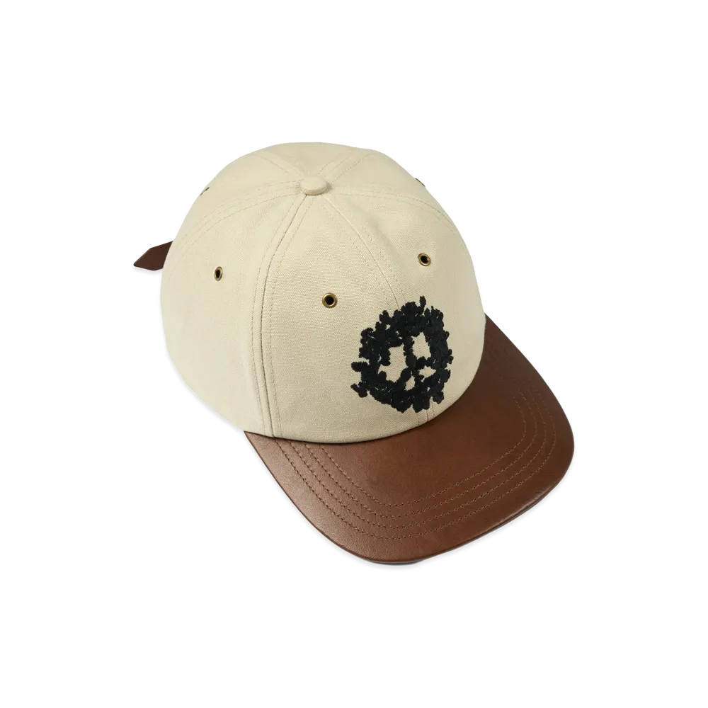 DENIM TEARS Peace Wreath Leather Brim Cap "Creme Brulee"