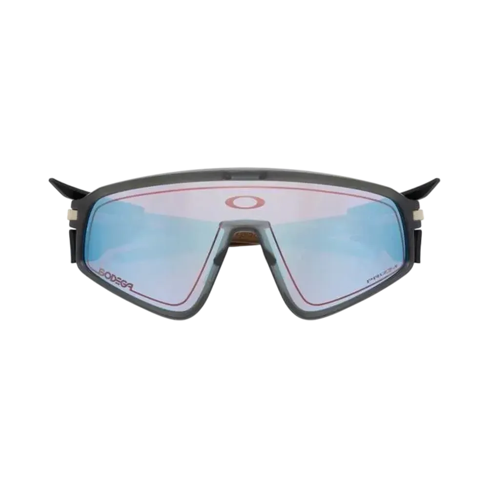 Bodega x OAKLEY Latch Panel Brass "Prizm Snow Sapphire"