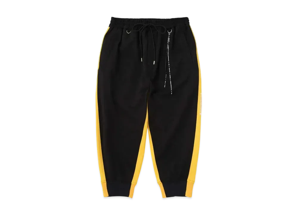 mastermind WORLD Cropped Track Pants "Black Yellow"