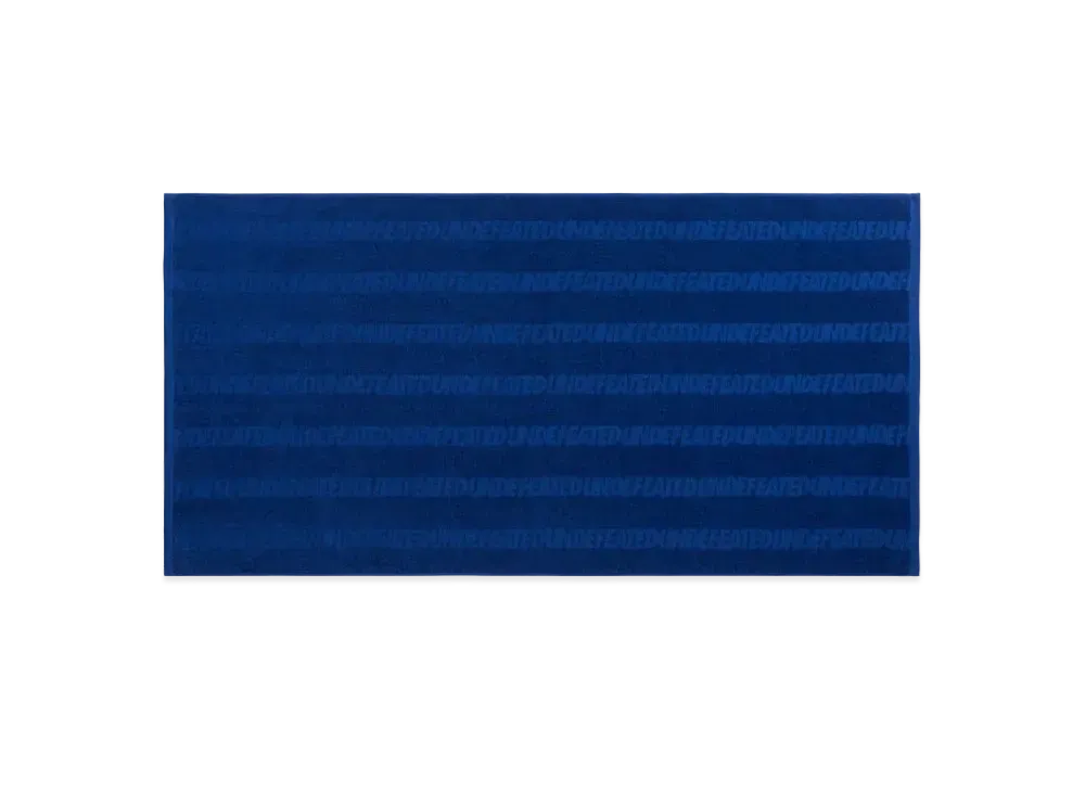 UNDEFEATED REPEAT LOGO BEACH TOWEL - 02110 "Blue"