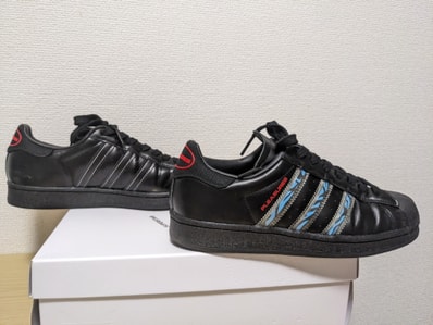 PLEASURES × adidas CONSORTIUM SUPERSTAR "BLACK"