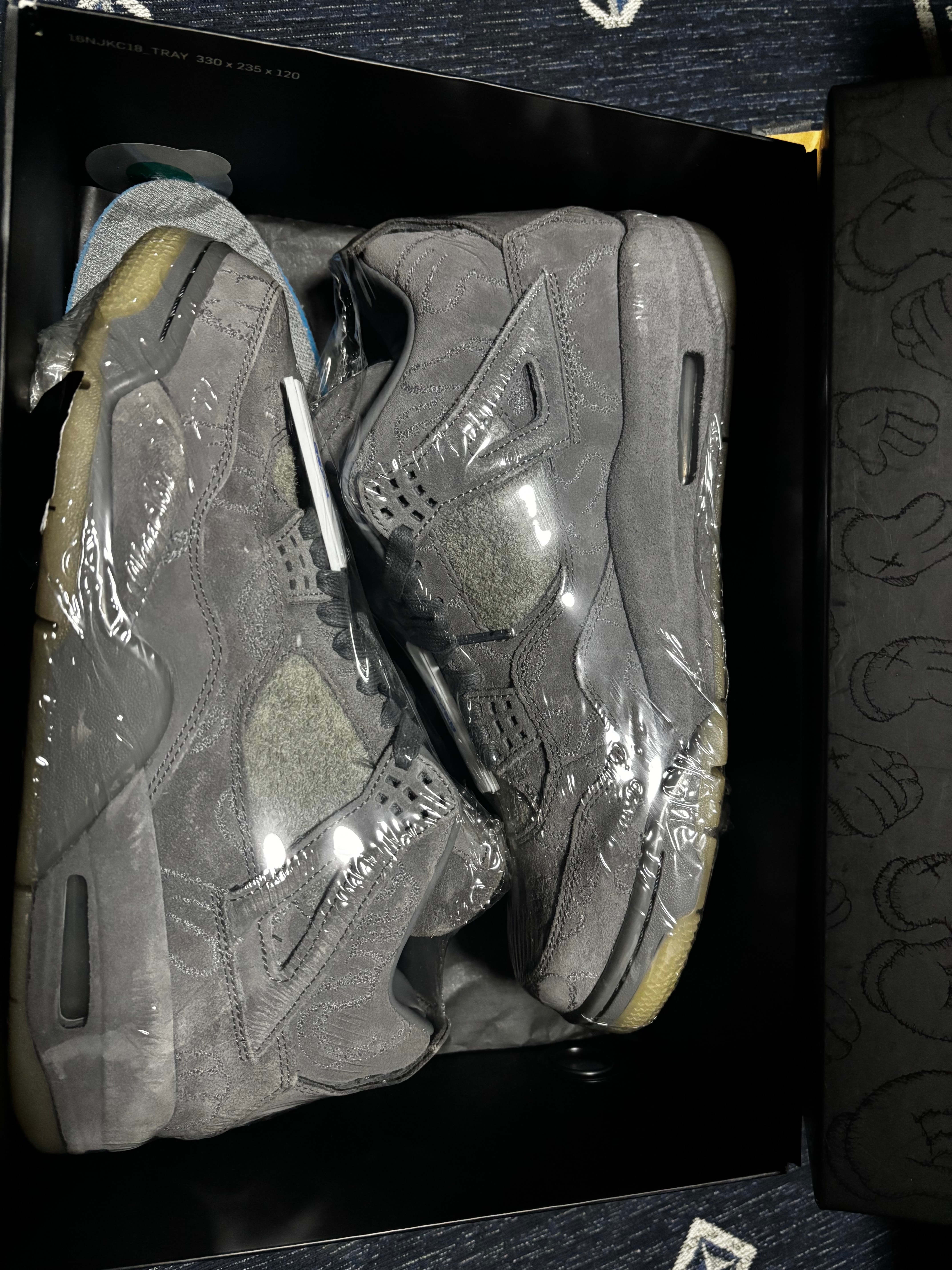 KAWS × Nike Air Jordan 4 Retro "Grey"