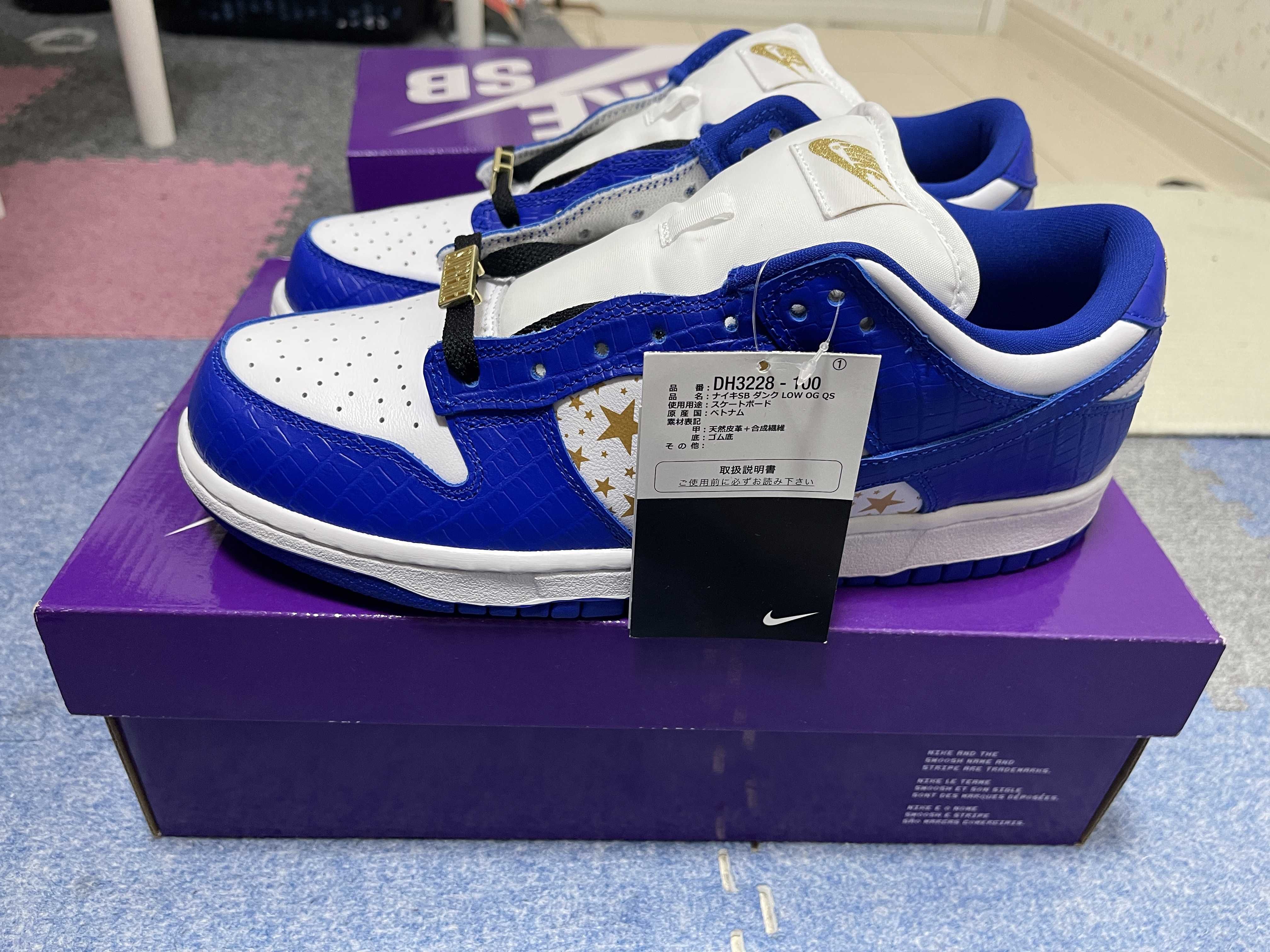 Supreme × Nike SB Dunk Low OG QS Gold Stars "White/Hyper Blue"