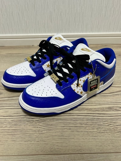 Supreme × Nike SB Dunk Low OG QS Gold Stars "White/Hyper Blue"
