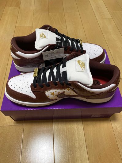 Supreme × Nike SB Dunk Low OG QS Gold Stars