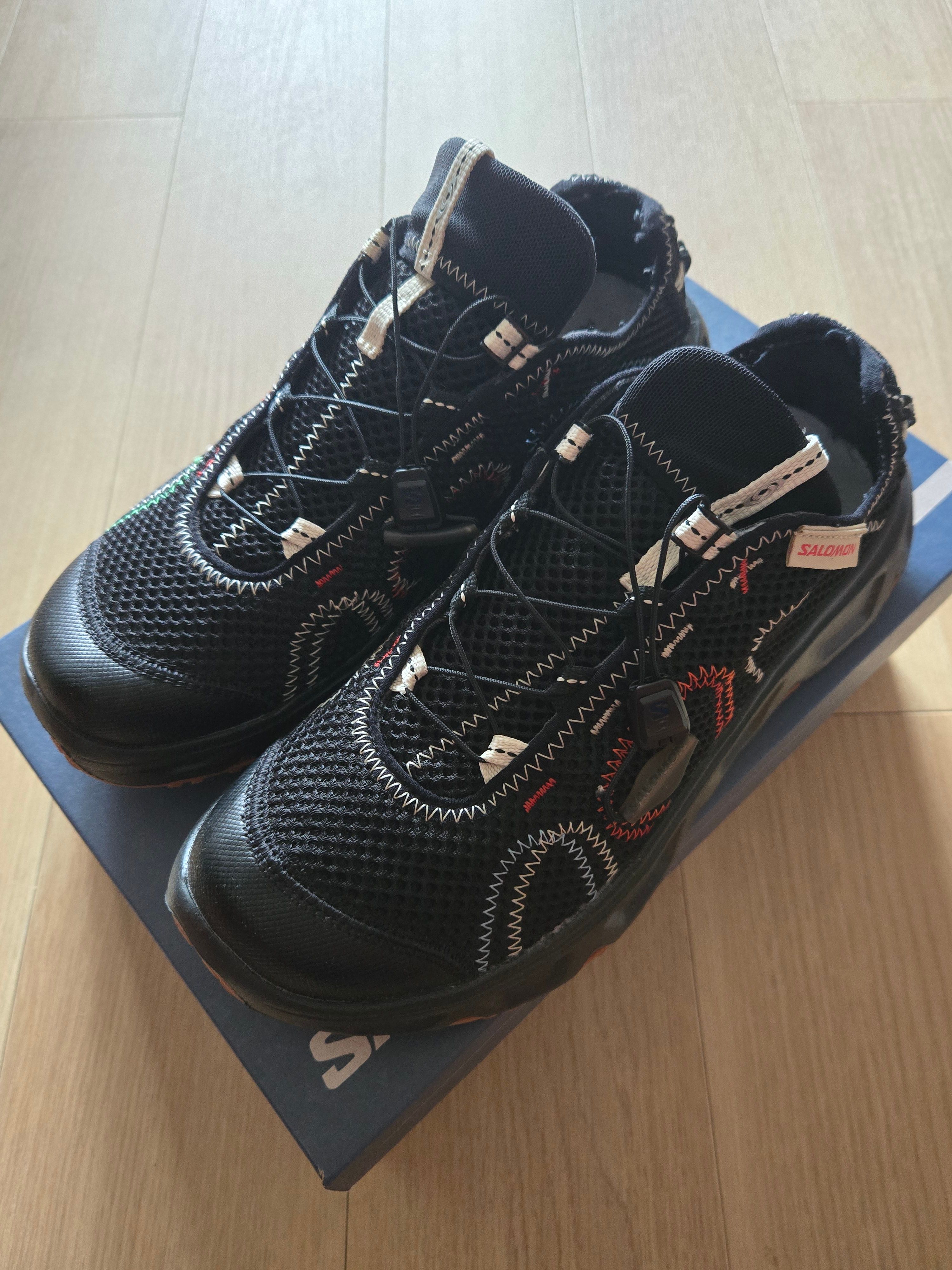 The Broken Arm × Salomon RX Travel 6.0 "Black/Bleached Sand/High Risk Red"