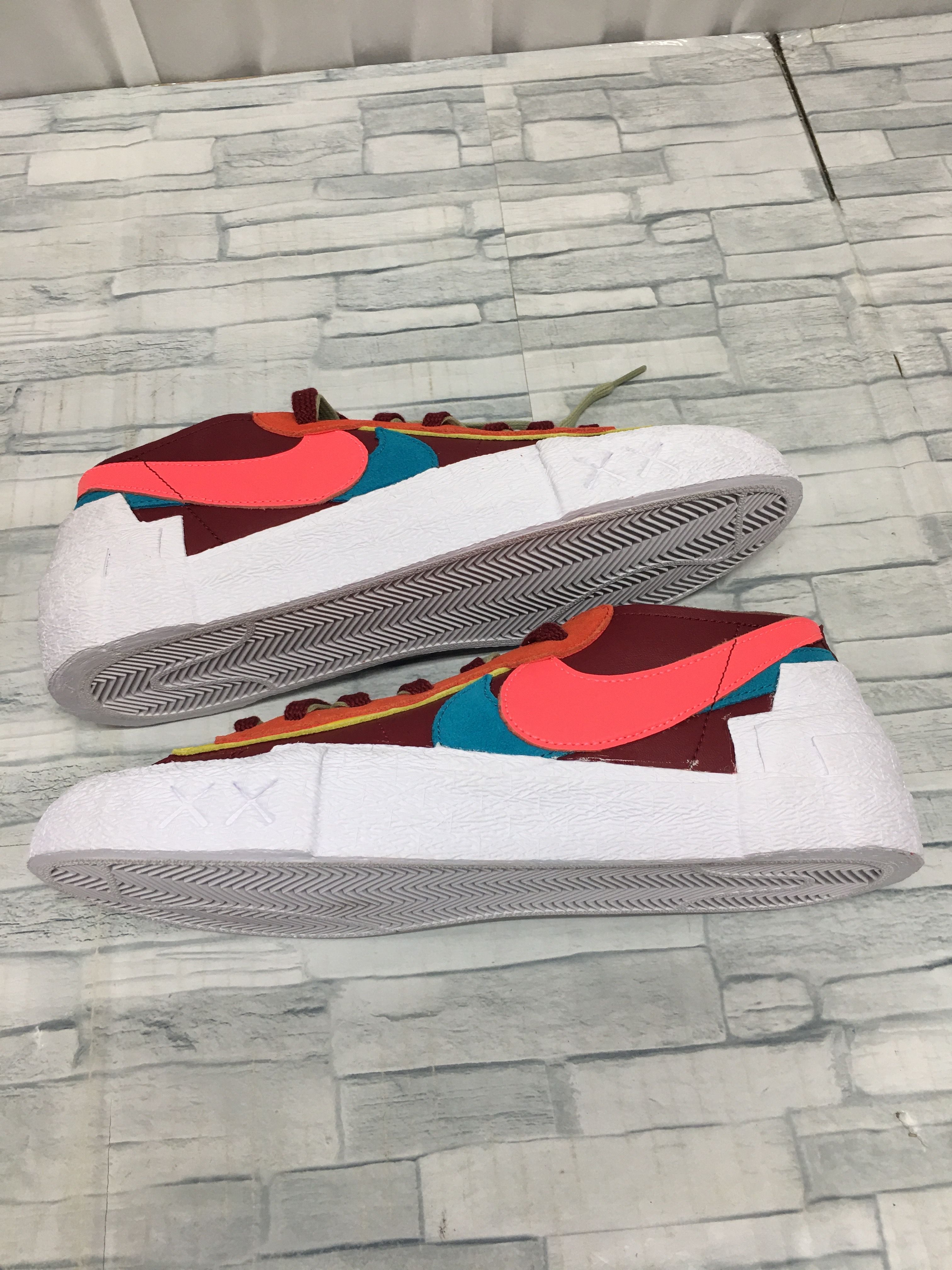 KAWS × sacai × Nike Blazer Low "Team Red"