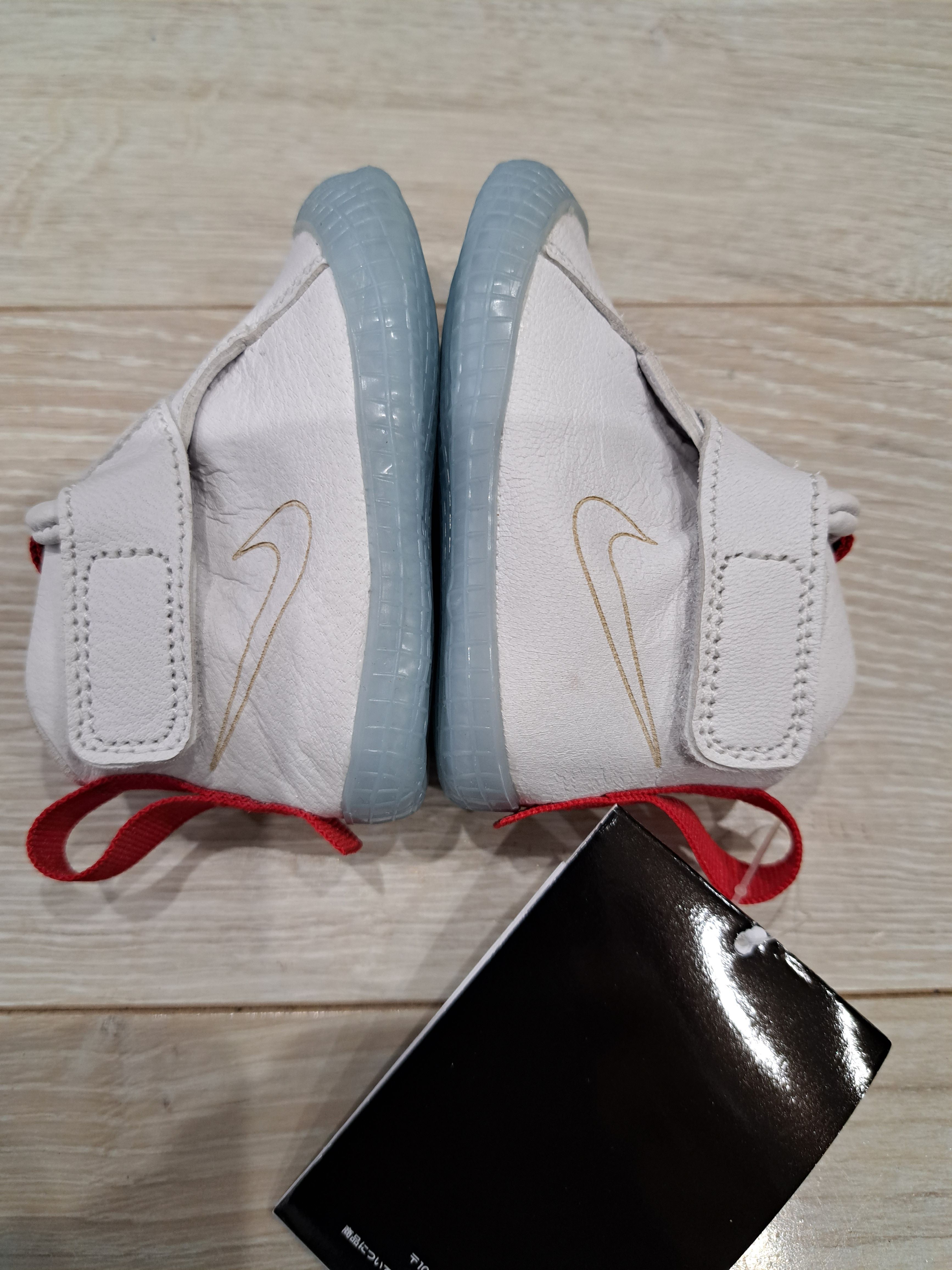 Tom Sachs × Nike TD Crib Bootie Marsyard 2.0 Overshoe "Sport Red/Maple"