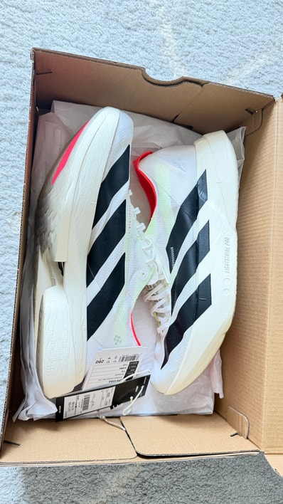 adidas Adizero Adios Pro 4 "Footwear White/Core Black/Silver Metallic"