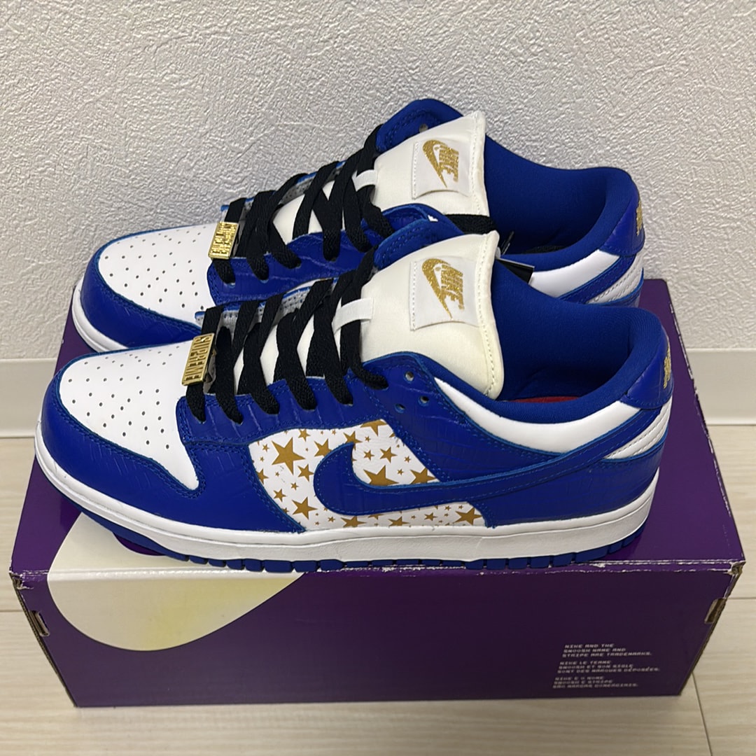 Supreme × Nike SB Dunk Low OG QS Gold Stars "White/Hyper Blue"