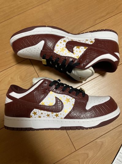 Supreme × Nike SB Dunk Low OG QS Gold Stars