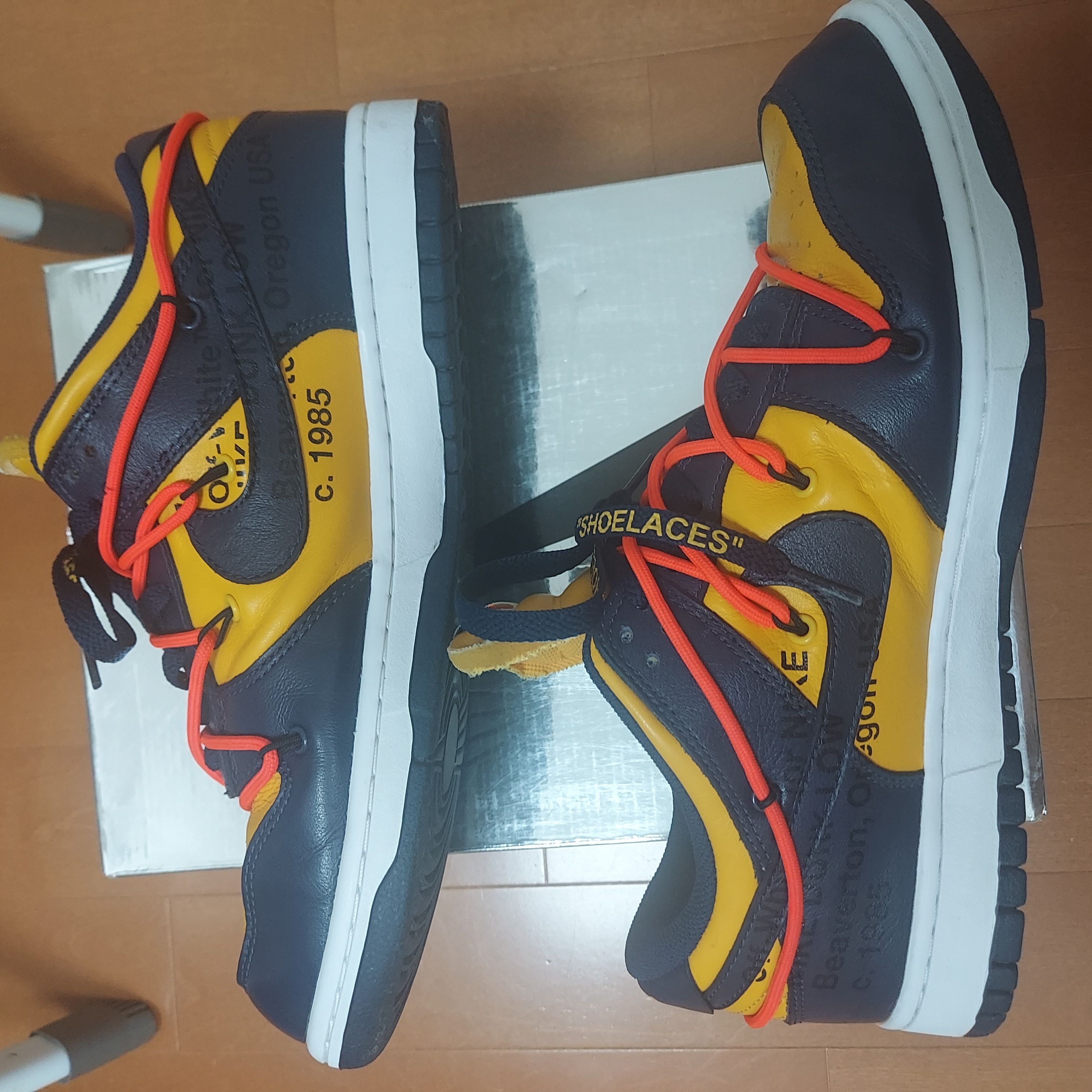Off-White × Nike Dunk Low LTHR "University Gold/Midnight Navy/White"