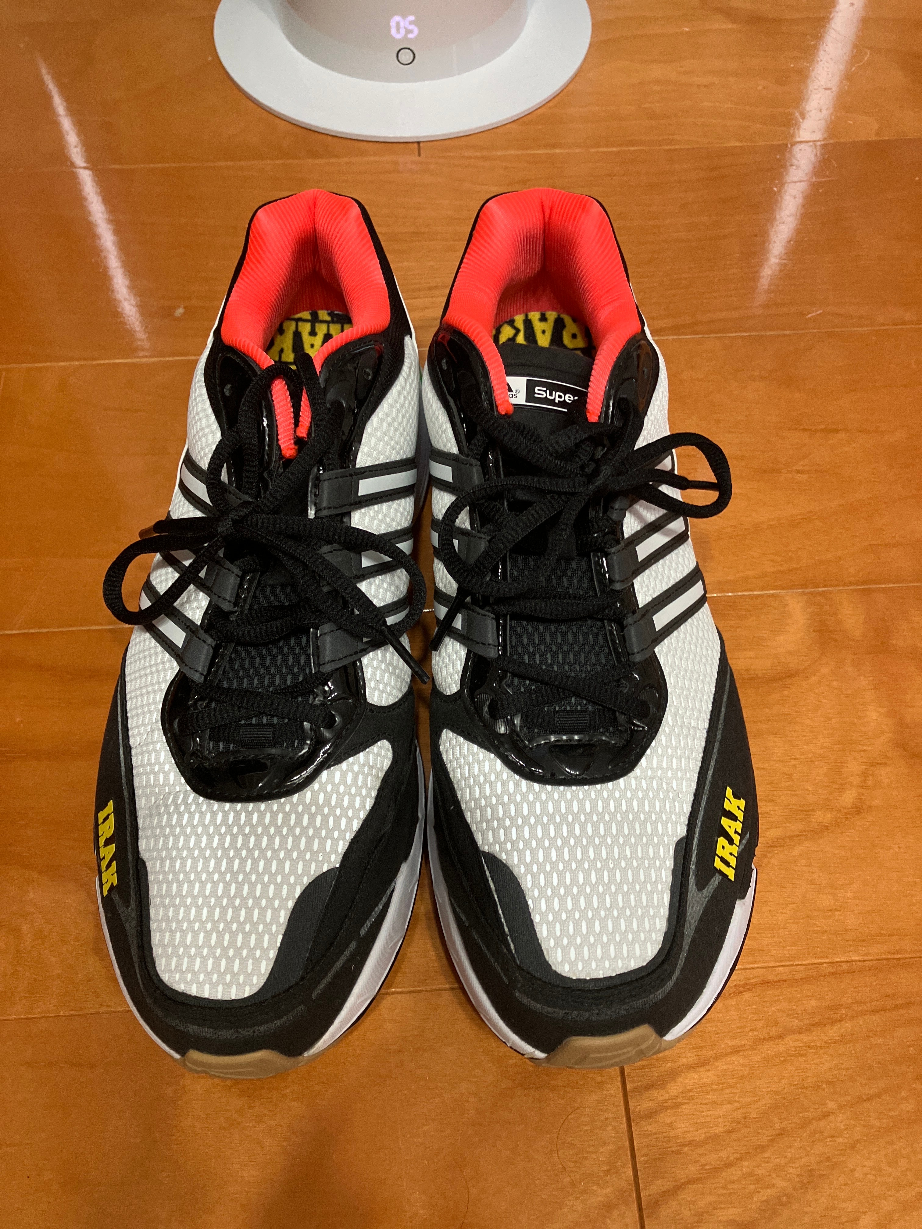 アディダス スーパーノヴァ クッション 7 アイラック "コアブラック/フットウェアホワイト/ビビッドグリーン"