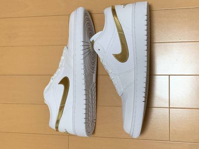 NIKE Women's AIR JORDAN 1 LOW SE "WHITE/GOLD"