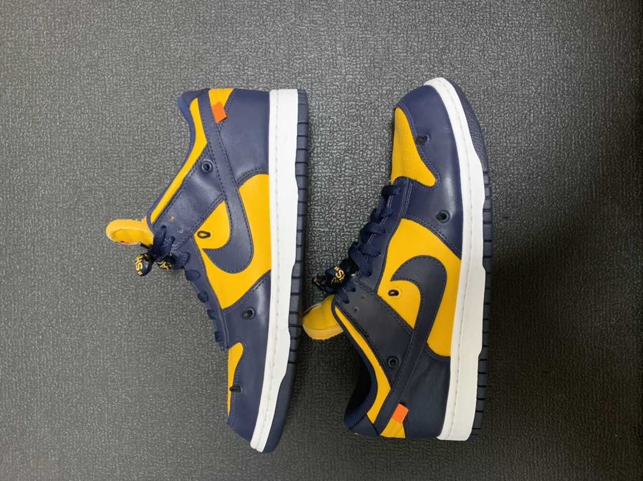 Off-White × Nike Dunk Low LTHR "University Gold/Midnight Navy/White"