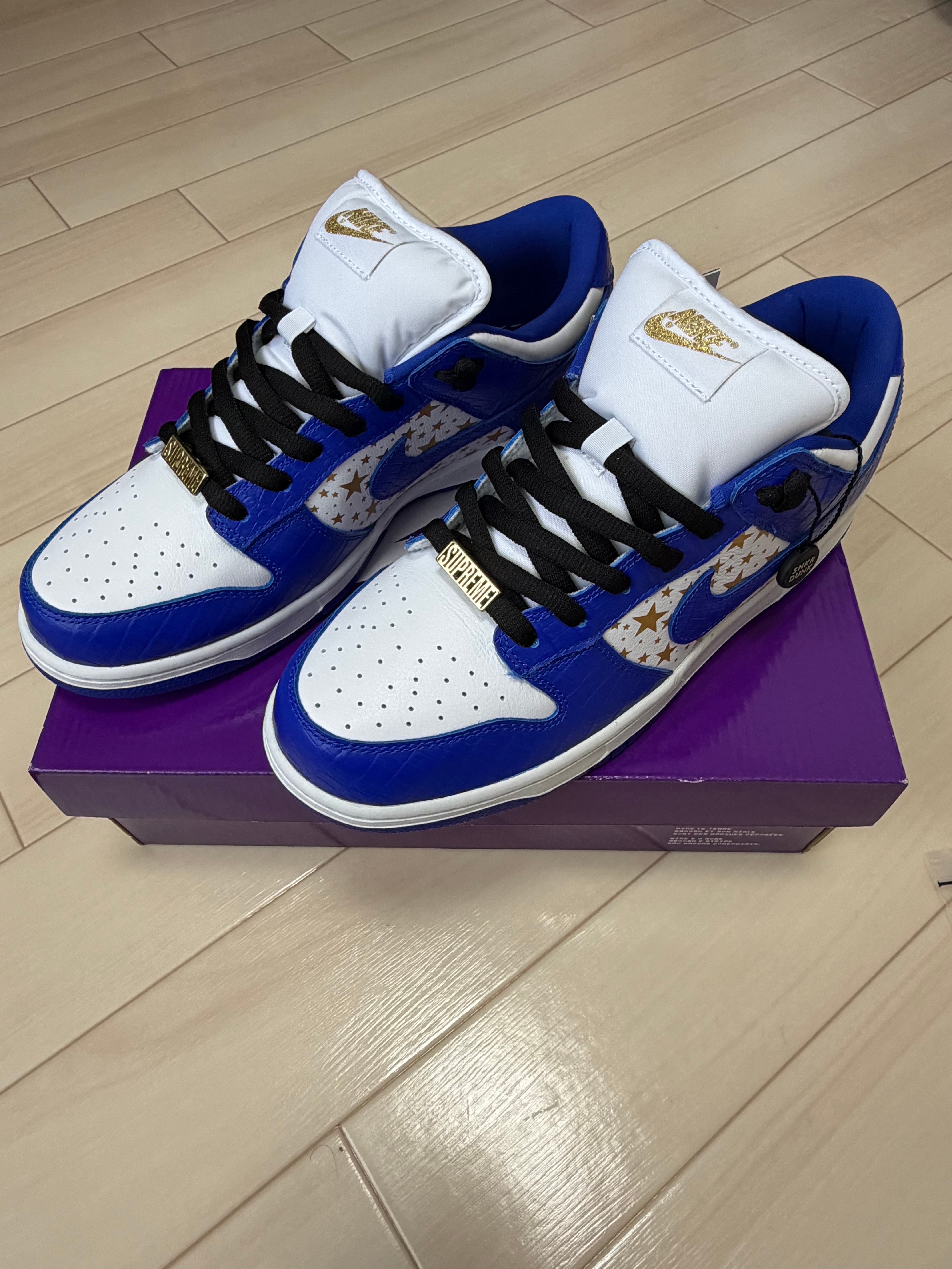 Supreme × Nike SB Dunk Low OG QS Gold Stars "White/Hyper Blue"