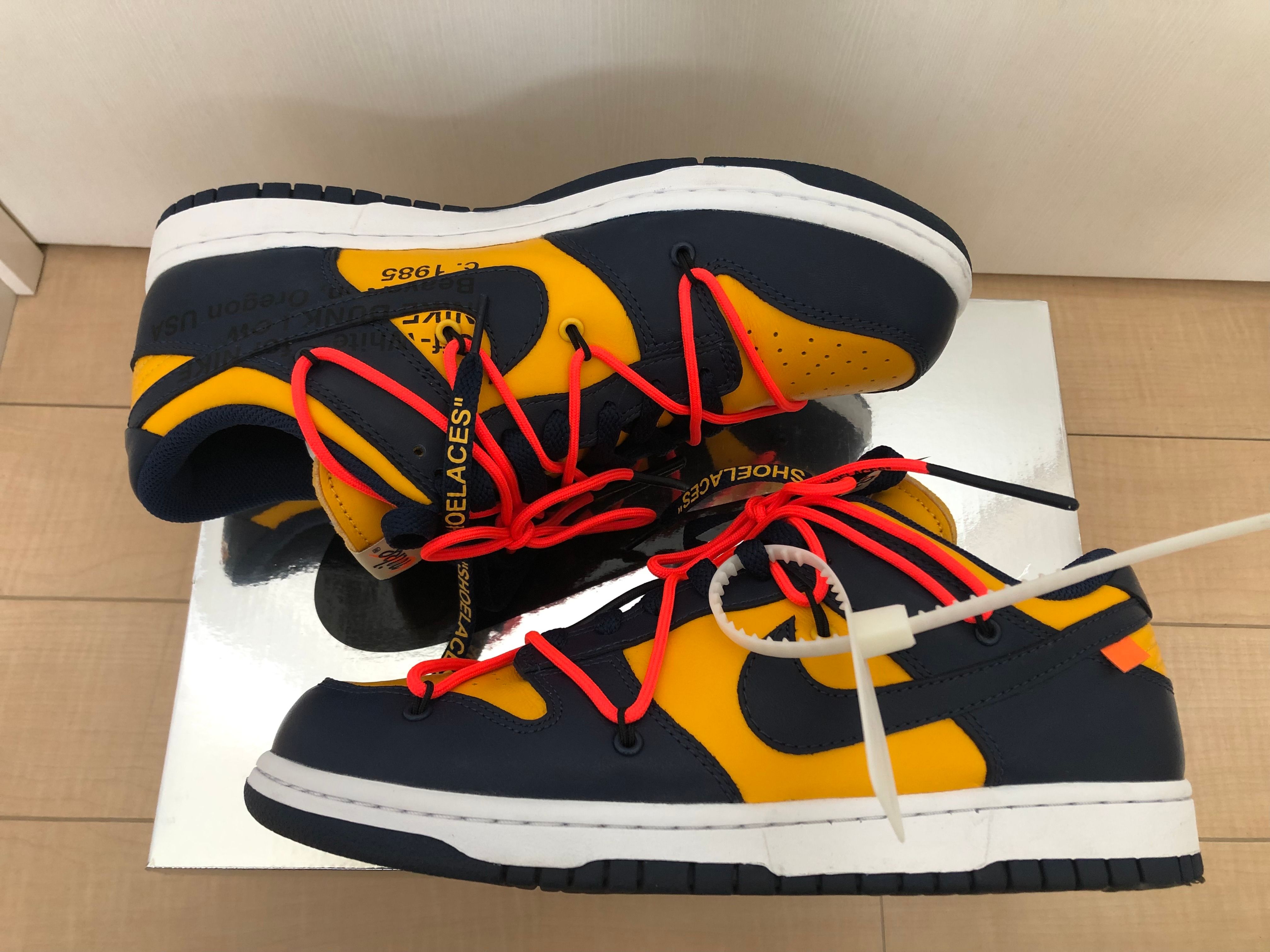 Off-White × Nike Dunk Low LTHR "University Gold/Midnight Navy/White"