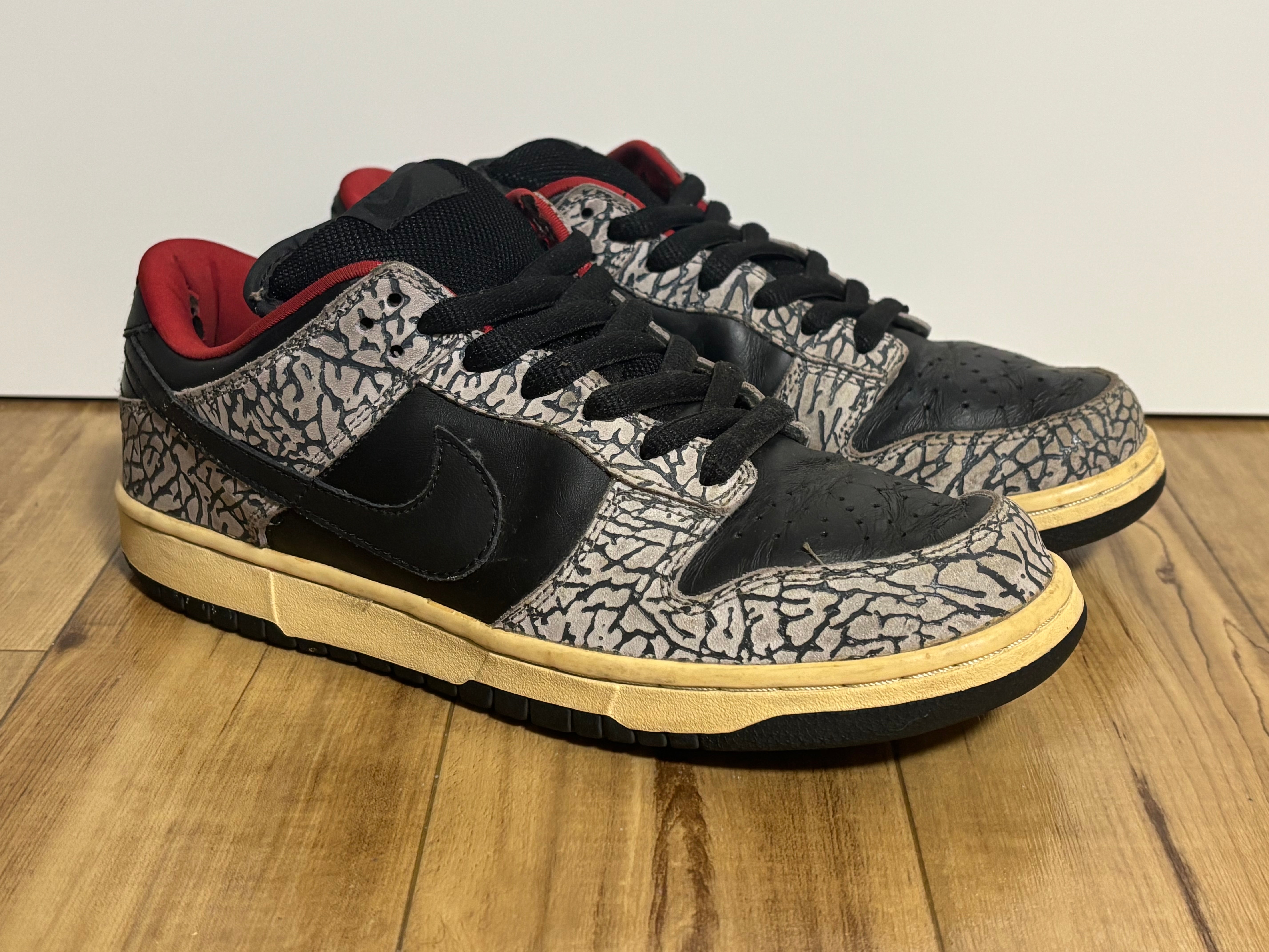 Supreme × Nike SB Dunk Low "Black Cement/Safari" (2002)