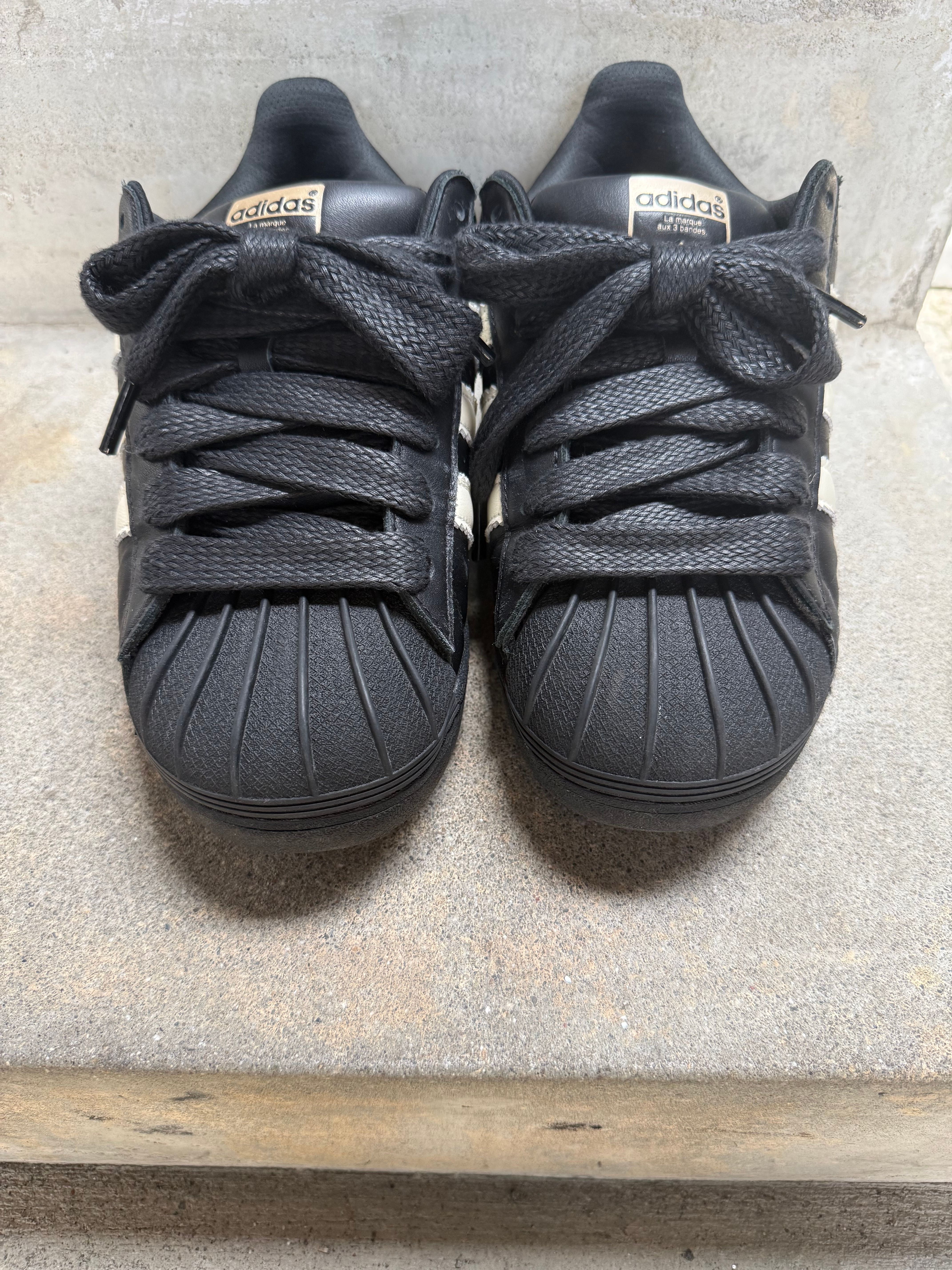 Pharrell Williams × adidas Superstar 92 "Core Black/Sky Rush/Cream White"