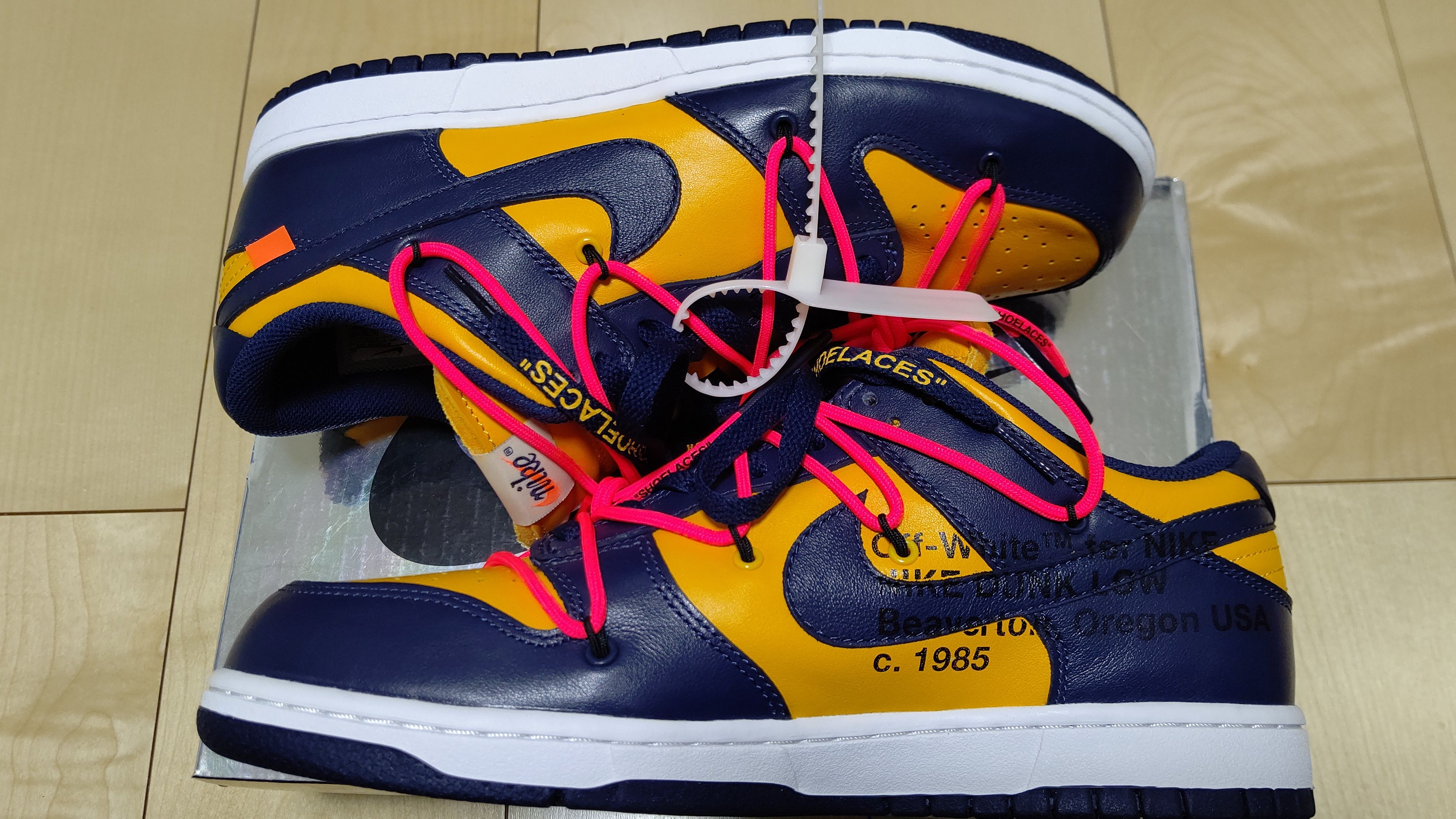 Off-White × Nike Dunk Low LTHR "University Gold/Midnight Navy/White"