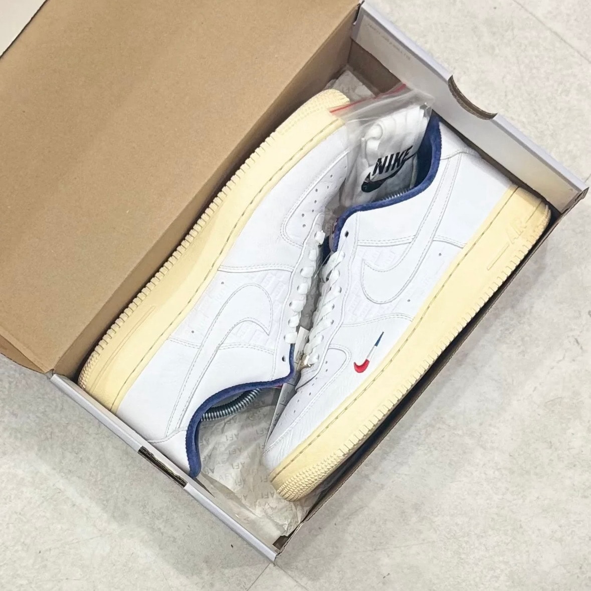 Kith × Nike Air Force 1 Low "France"
