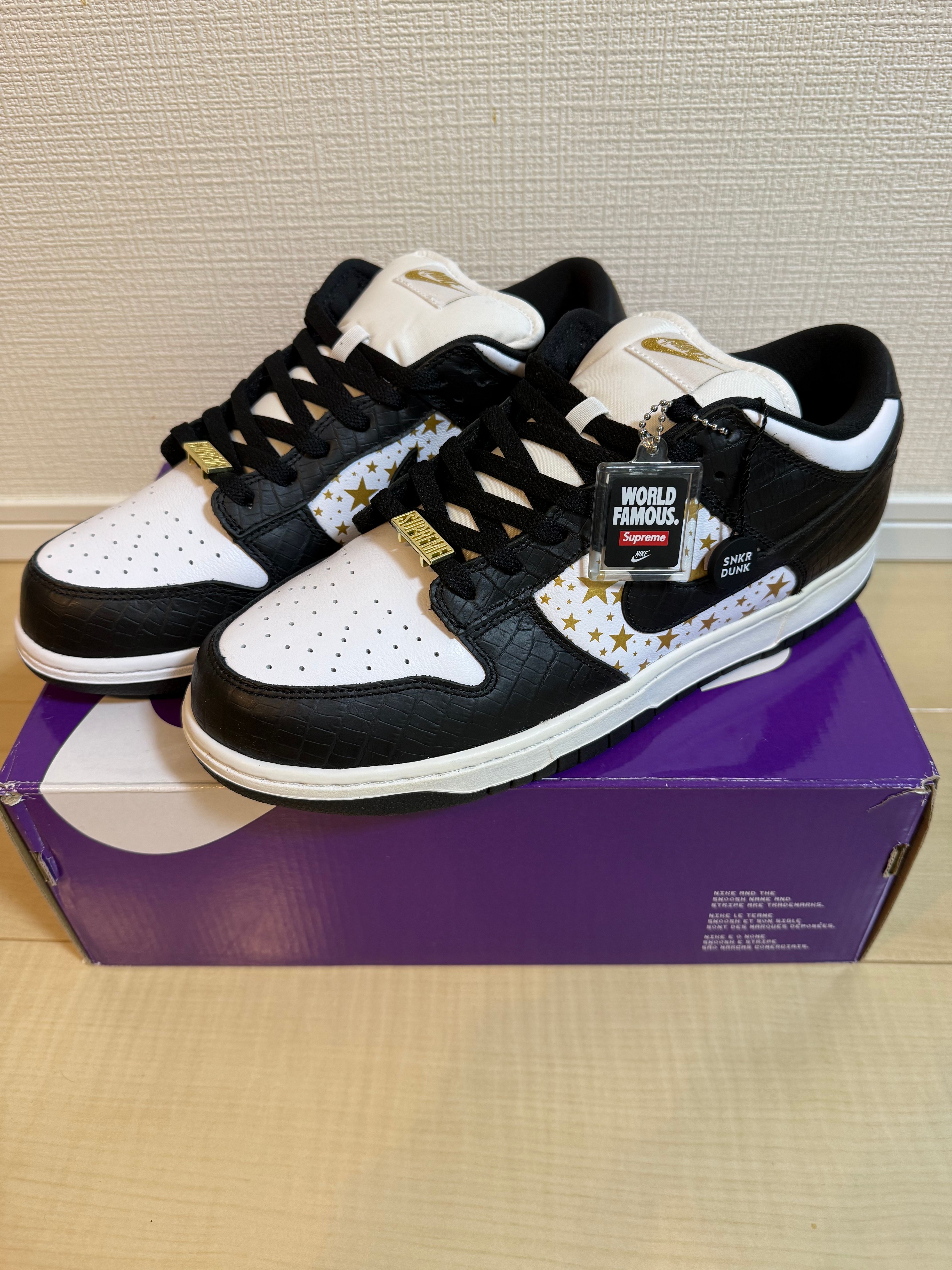 Supreme × Nike SB Dunk Low OG QS Gold Stars "White/Black"