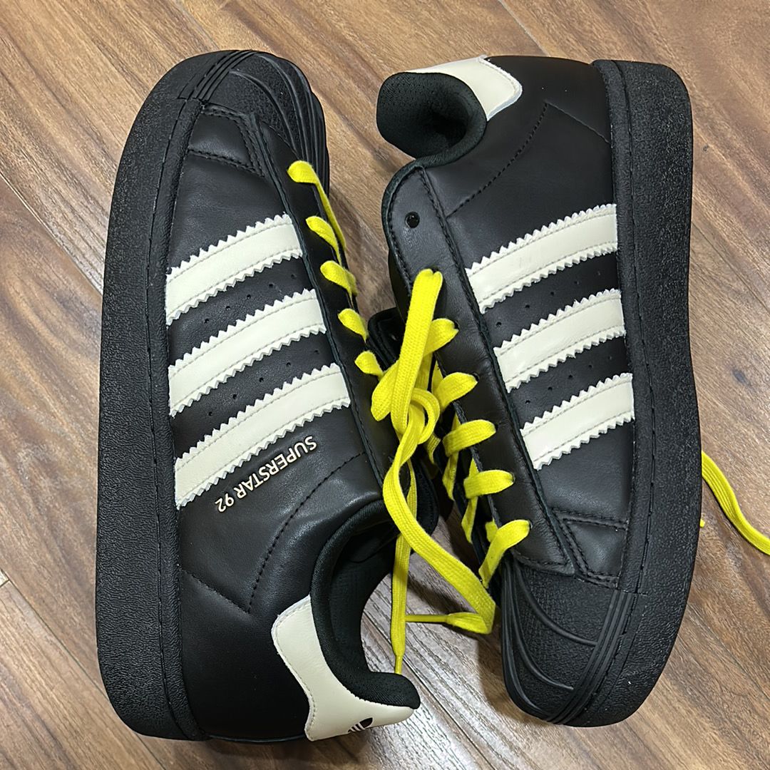 Pharrell Williams × adidas Superstar 92 "Core Black/Sky Rush/Cream White"