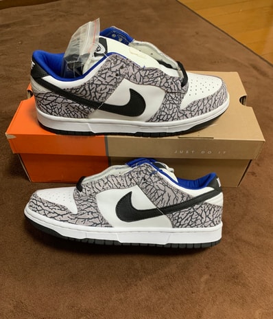 Supreme × Nike SB Dunk Low "White Cement/Safari" (2002)