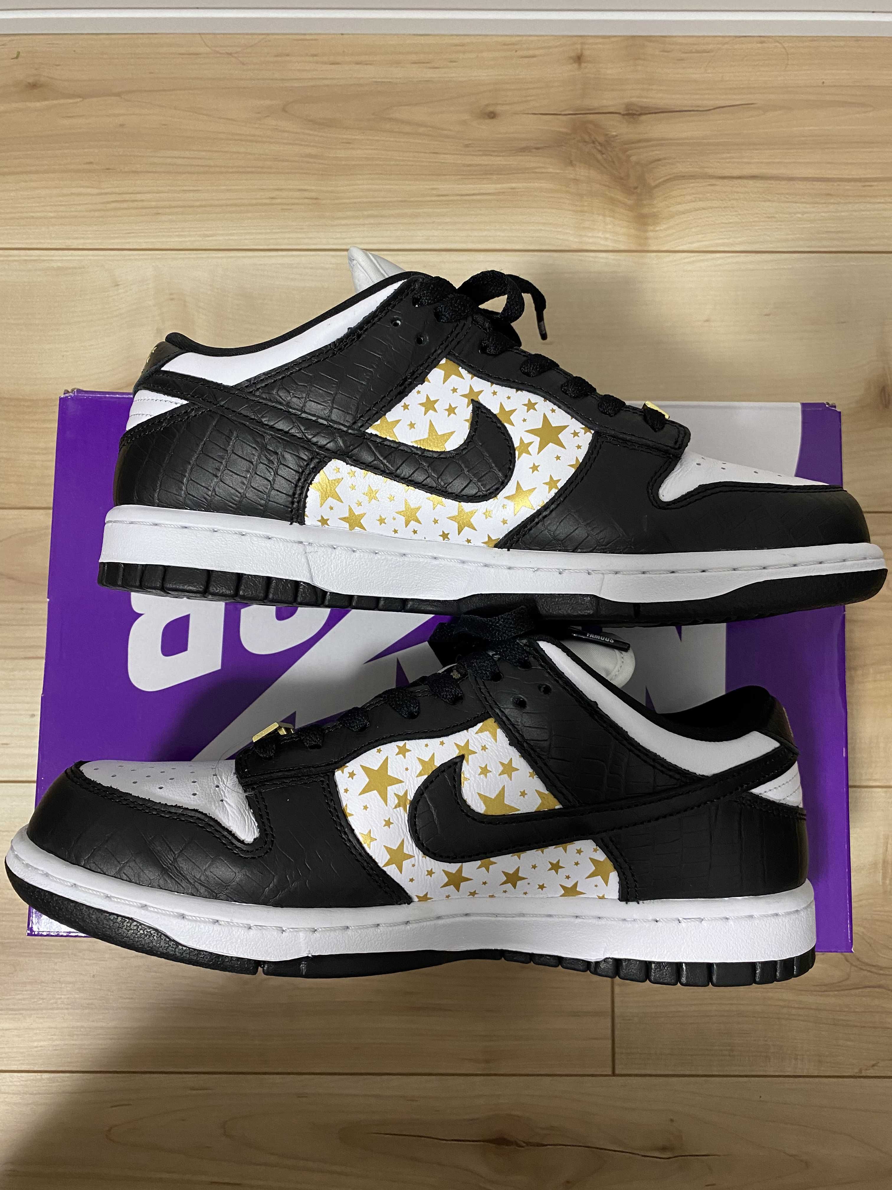 Supreme × Nike SB Dunk Low OG QS Gold Stars "White/Black"