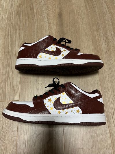 Supreme × Nike SB Dunk Low OG QS Gold Stars