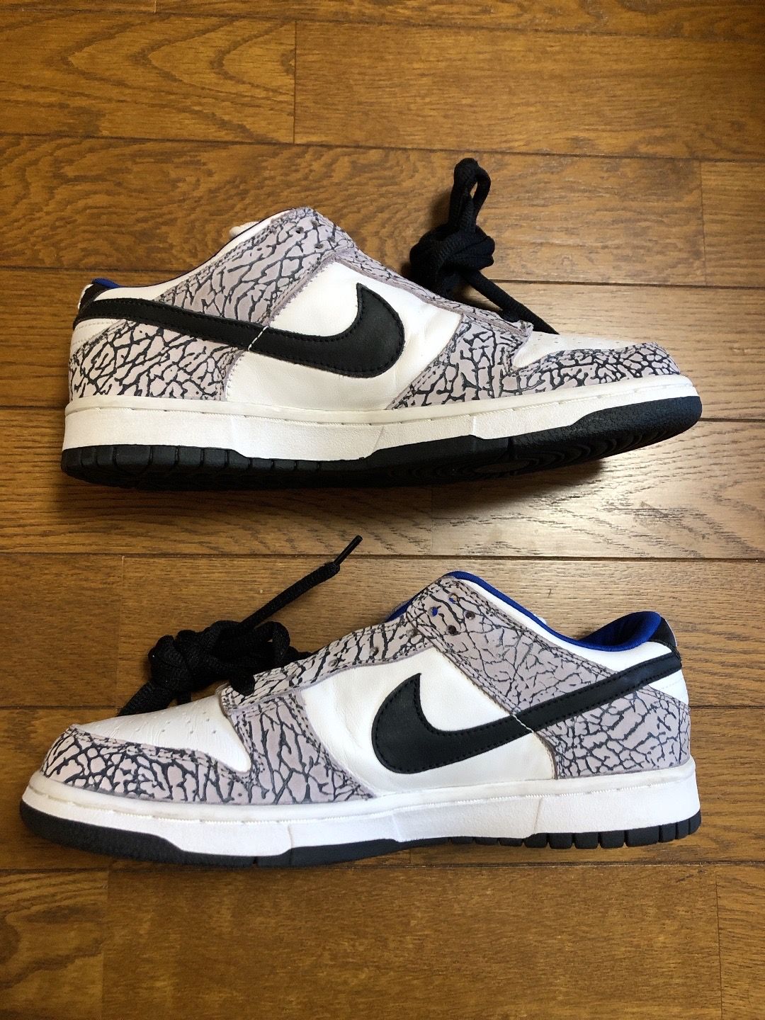 Supreme × Nike SB Dunk Low "White Cement/Safari" (2002)