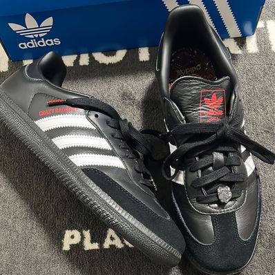 Crazy Raccoon × atmos × adidas Samba "Core Black/Footwear White/Better Scarlet"