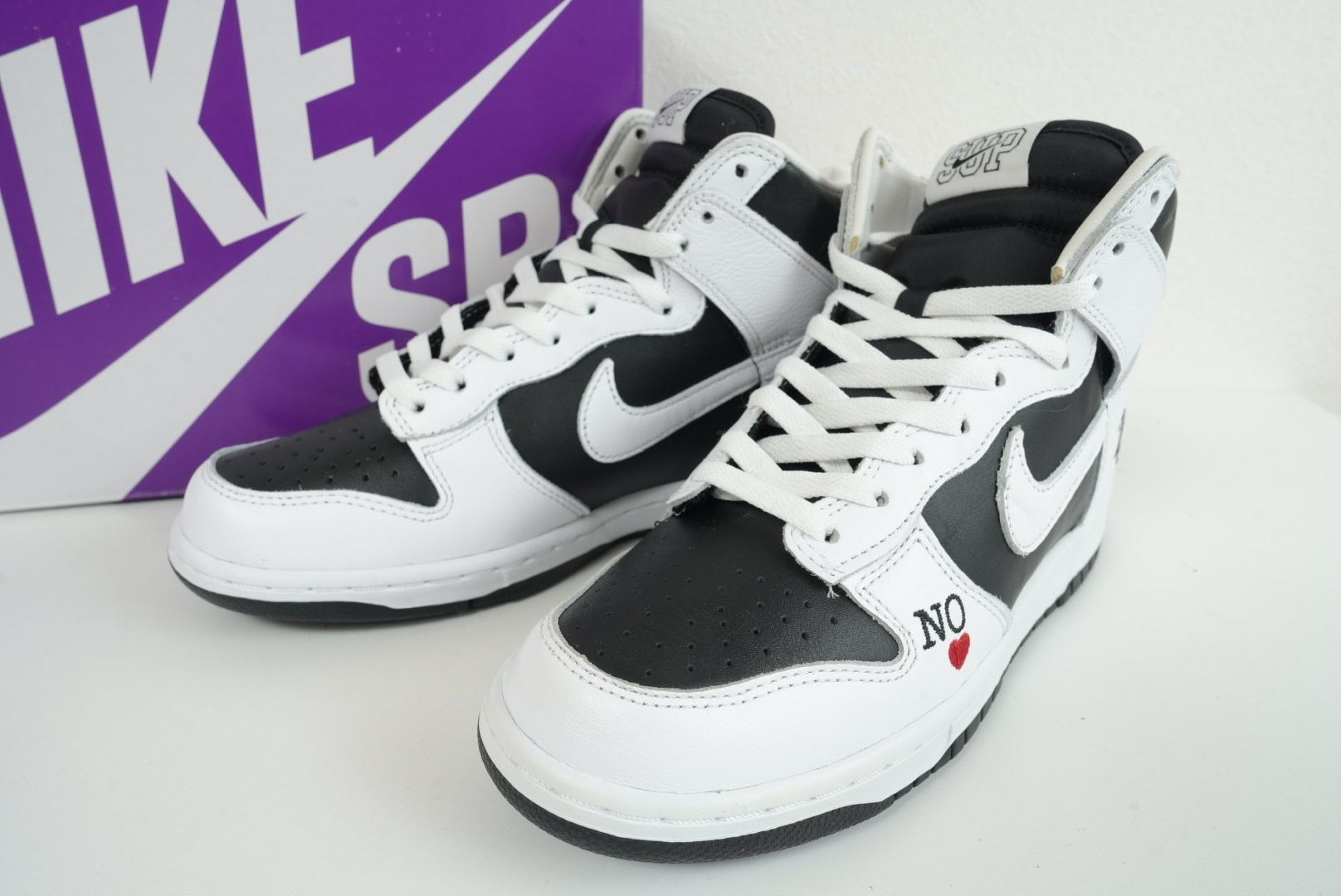 Supreme × Nike SB Dunk High By Any Means "White Black"
