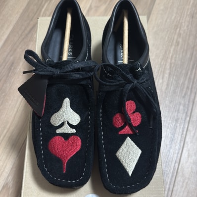 Stussy × Clarks Wallabee "Black Suede/Red/Gold"