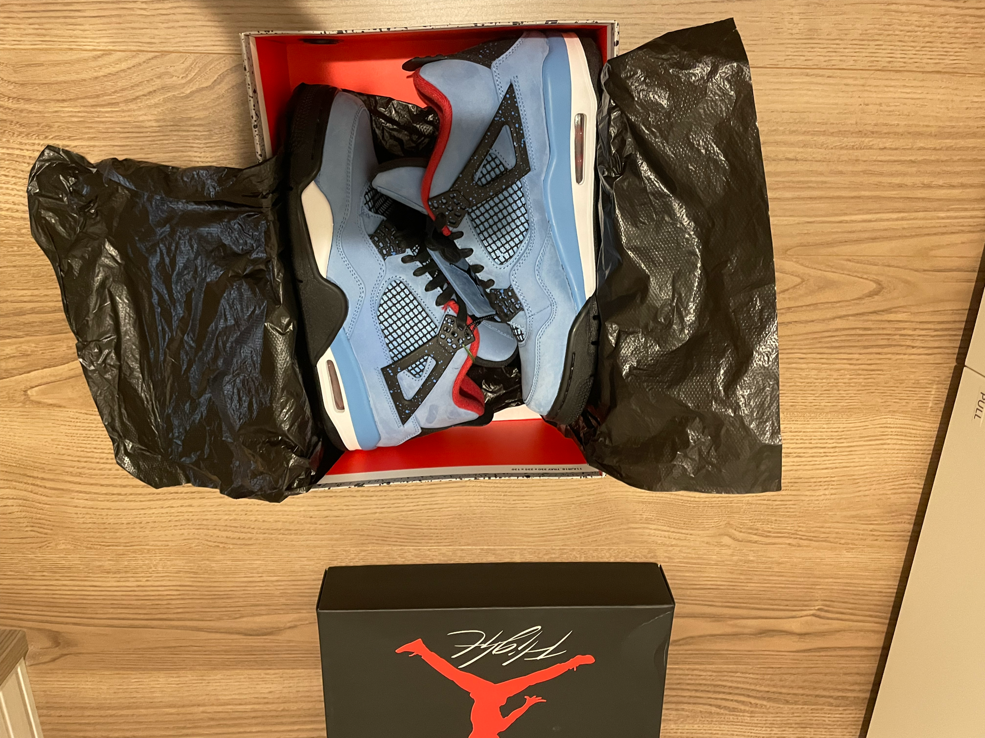 Travis Scott × Nike Air Jordan 4 Retro Cactus Jack "University Blue"