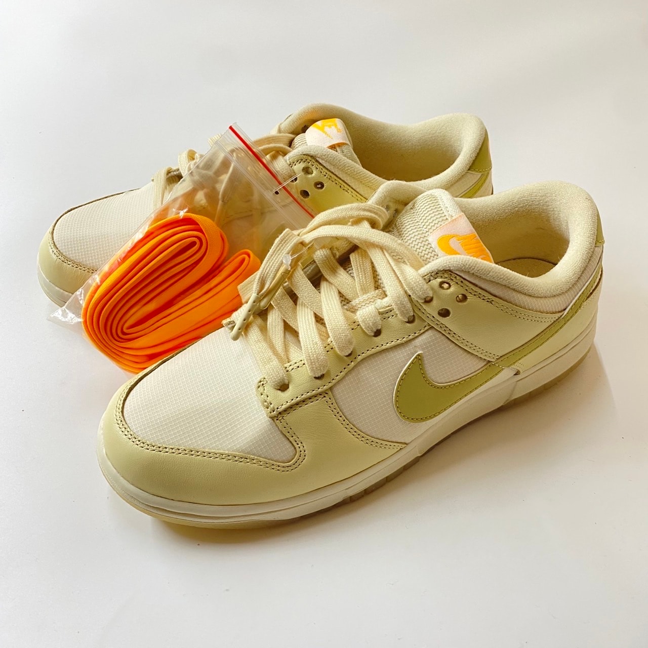 Nike Women's Dunk Low "Muslin/Pale Ivory/Laser Orange/Team Gold"