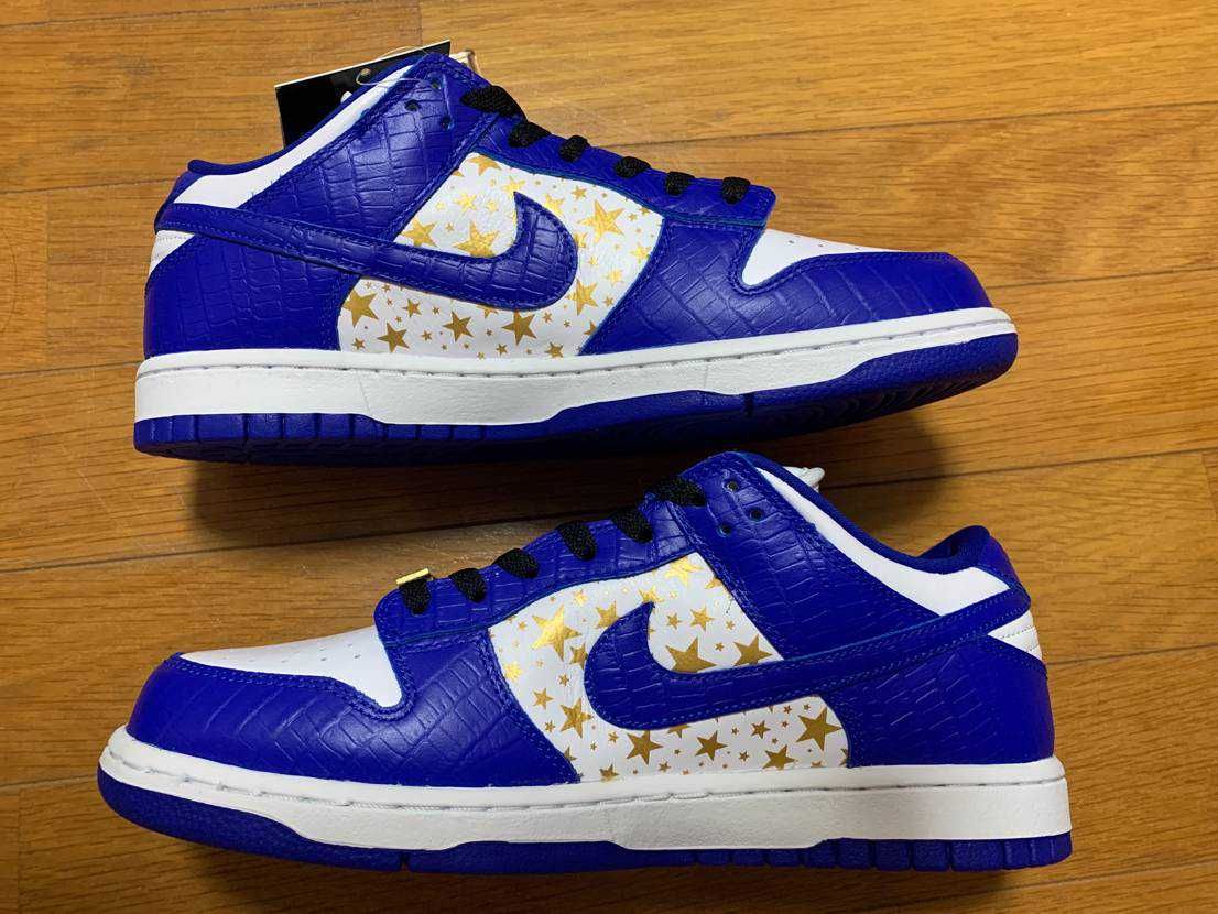 Supreme × Nike SB Dunk Low OG QS Gold Stars "White/Hyper Blue"