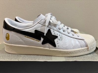 A BATHING APE × adidas Superstar V "Footwear White/Core Black/Gold Metallic"