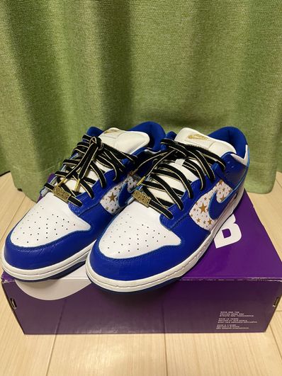 Supreme × Nike SB Dunk Low OG QS Gold Stars "White/Hyper Blue"