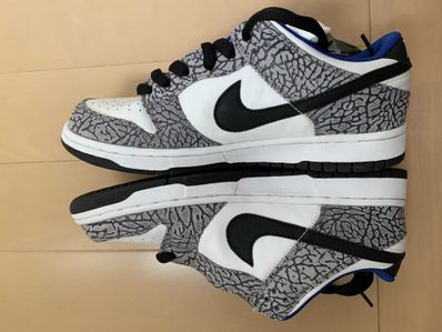 Supreme × Nike SB Dunk Low "White Cement/Safari" (2002)