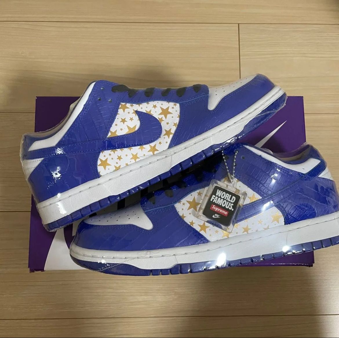 Supreme × Nike SB Dunk Low OG QS Gold Stars "White/Hyper Blue"