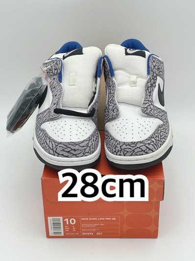 Supreme × Nike SB Dunk Low "White Cement/Safari" (2002)