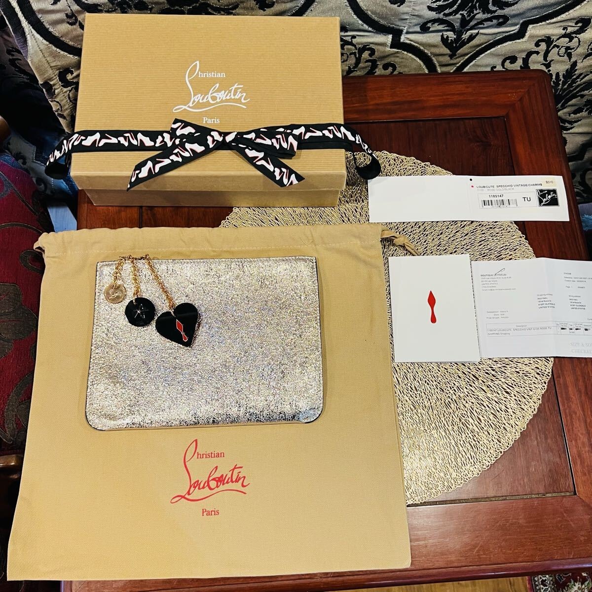 Christian Louboutinクリスチャンルブタン　ポーチ・クラッチバック　チャーム付き