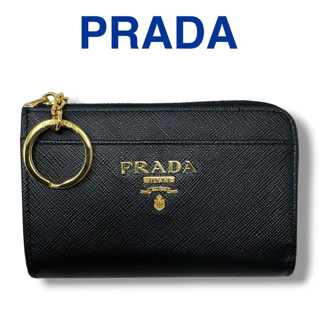 PRADA プラダ サフィアーノ フィオッコ リボン ネイビー ゴールド金具 レザー 折り財布 コンパクトウォレット レディース 601922 【中古】 PRADA - PRADA プラダ サフィアーノ フィオッコ リボン ネイビー