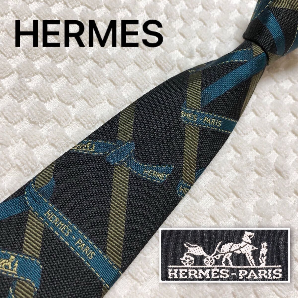 ■美品■超稀少ロゴ入りデザイン■HERMES エルメス　ネクタイ　米国式右下がりストライプ×ロゴリボン　総柄　シルク100% フランス製