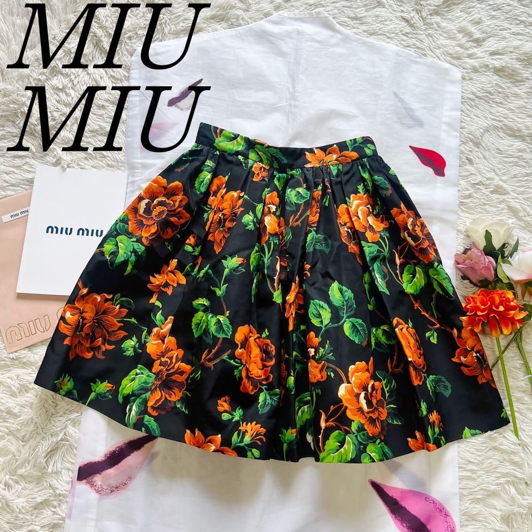 miu miuミュウミュウ　シルク　膝丈フレアスカート　オレンジ黒総柄　38M 中古・古着通販】MIU MIU (ミュウミュウ) フロントダブルジップ